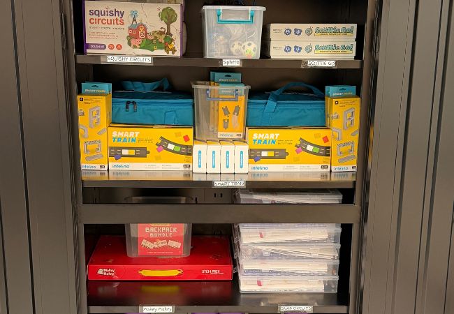 Shelves of building kits, 3D pens, and craft supplies